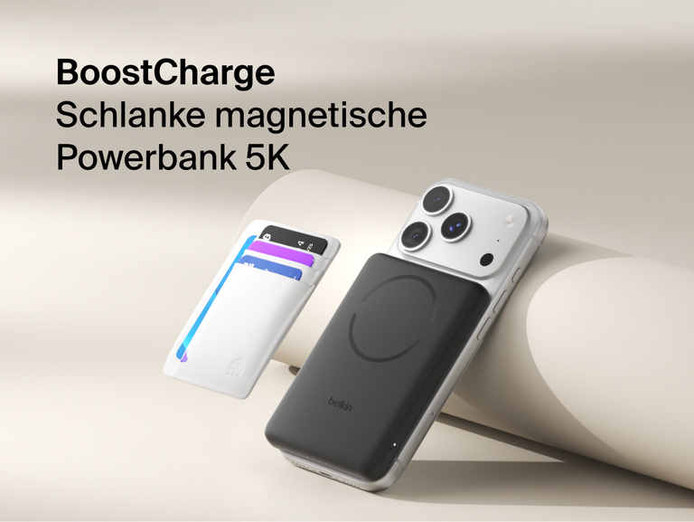 Belkin BoostCharge Slim Magnetic Power Bank 5K with Qi2 wirelessly attached to a smartphone, featuring a slim magnetic design with integrated card storage for portable on-the-go charging.
