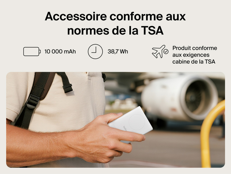 Belkin UltraCharge Pro Power Bank 10K with magnetic ring shown in hand at an airport, highlighting TSA-compliant 10,000 mAh capacity for travel-ready portable charging.