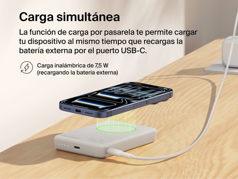 Belkin BoostCharge Slim Magnetic Power Bank 10K delivering pass-through charging with a smartphone wirelessly charging on top while the power bank recharges via USB-C cable