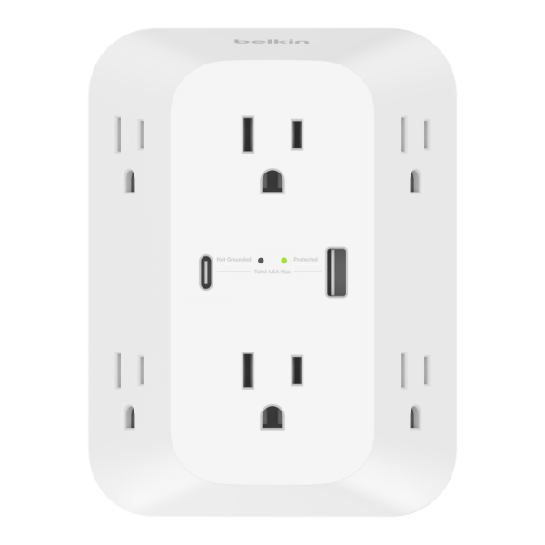 Belkin white wall-mounted surge protector with six side-facing AC outlets, two front-facing USB ports (one USB-C and one USB-A), three front-facing AC outlets, and indicator lights showing protection and grounding status.