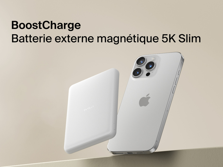 Belkin BoostCharge Slim Magnetic Power Bank 5K shown magnetically attached to a smartphone beside a slim wallet accessory, highlighting its compact portable charging design.