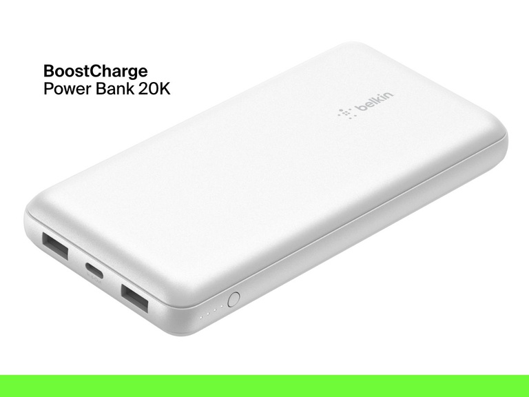 A white Belkin BoostCharge Power Bank 20K with dual USB-A ports, a USB-C port, LED battery indicator lights, and a power button is shown on a white background.