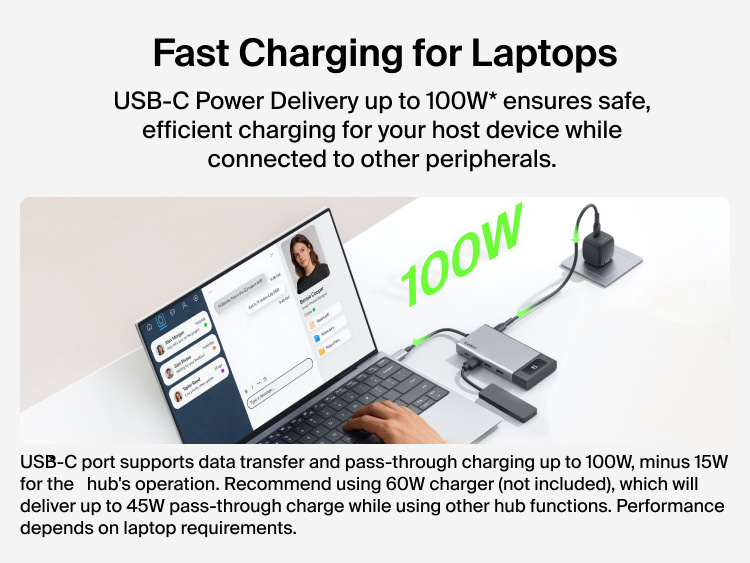 Person using a laptop connected to a Belkin USB-C hub while charging with up to 100W power delivery, demonstrating fast charging while connected to multiple peripherals.