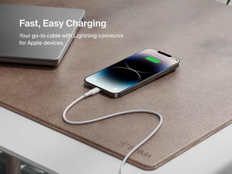 Belkin BoostCharge USB-C to USB-C Cable 240W shown charging MacBook Pro 14", iPhone 16 Pro Max, and Galaxy S25 from 0–50% in under 31 minutes, highlighting ultra-fast charging performance.