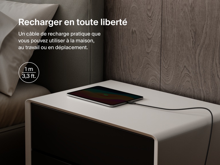 Belkin BoostCharge Pro USB-C to USB-C Braided Cable 240W shown charging a tablet on a nightstand, emphasizing its 1-meter (3.3 ft) length for convenient charging anywhere.