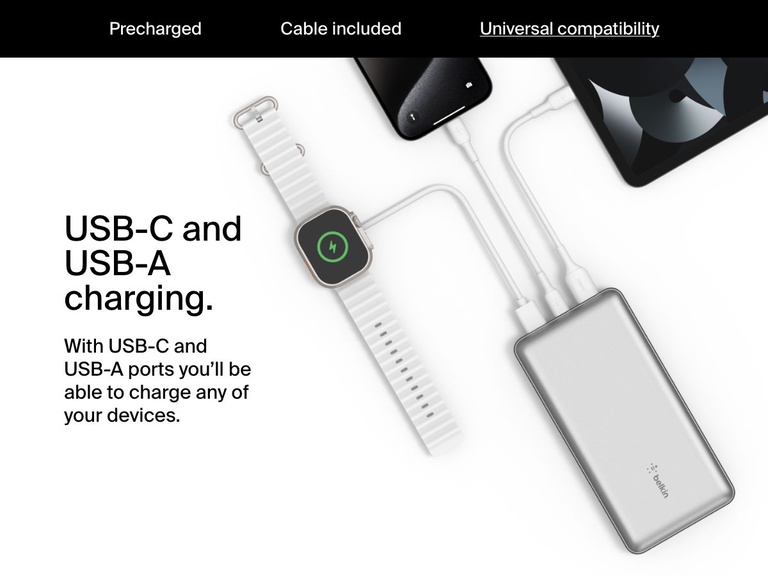 A silver Belkin BoostCharge Power Bank 20K is shown charging a smartwatch, smartphone, and tablet simultaneously via its USB-C and USB-A ports, demonstrating universal device compatibility.