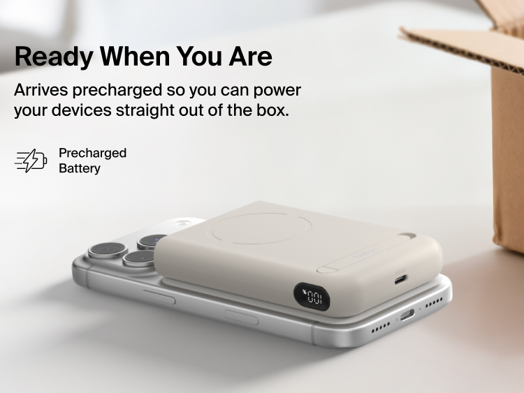 Belkin UltraCharge Pro Power Bank 10K with magnetic ring shown attached to a smartphone, highlighting a precharged battery and ready-to-use portable wireless charging straight out of the box.