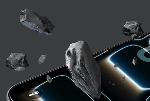 Close-up of a smartphone screen with a screen protector, surrounded by flying rocks, illustrating scratch resistance and durability against rough impact. Close-up of a smartphone screen with a screen protector, surrounded by flying rocks, illustrating scratch resistance and durability against rough impact.