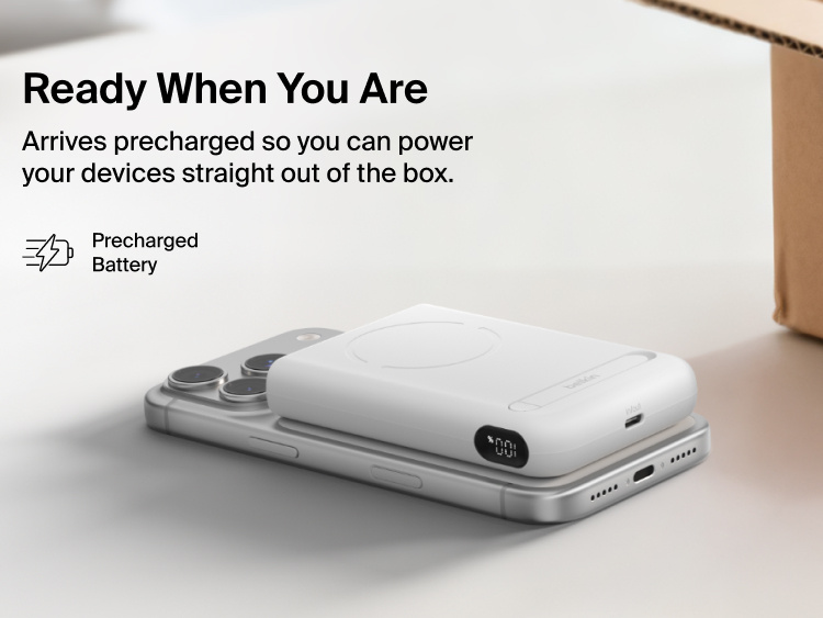 Belkin UltraCharge Pro Power Bank 10K with magnetic ring shown attached to a smartphone, highlighting a precharged battery and ready-to-use portable wireless charging straight out of the box.