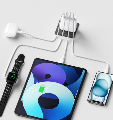 An image showcasing the BoostCharge Pro 4-Port GaN Wall Charger 112W, shown charging 4 devices simultaneously.