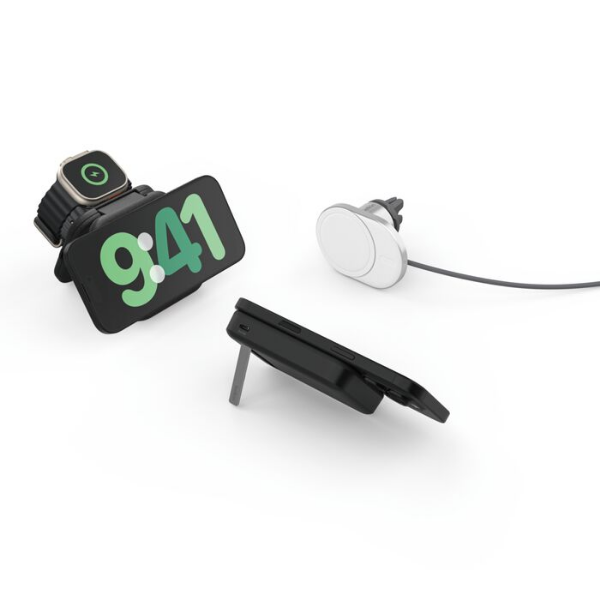 Three magnetic wireless charging accessories displayed: a black charging stand powering a smartphone and smartwatch, a white car vent charger with cable, and a black foldable charging pad with a built-in kickstand.