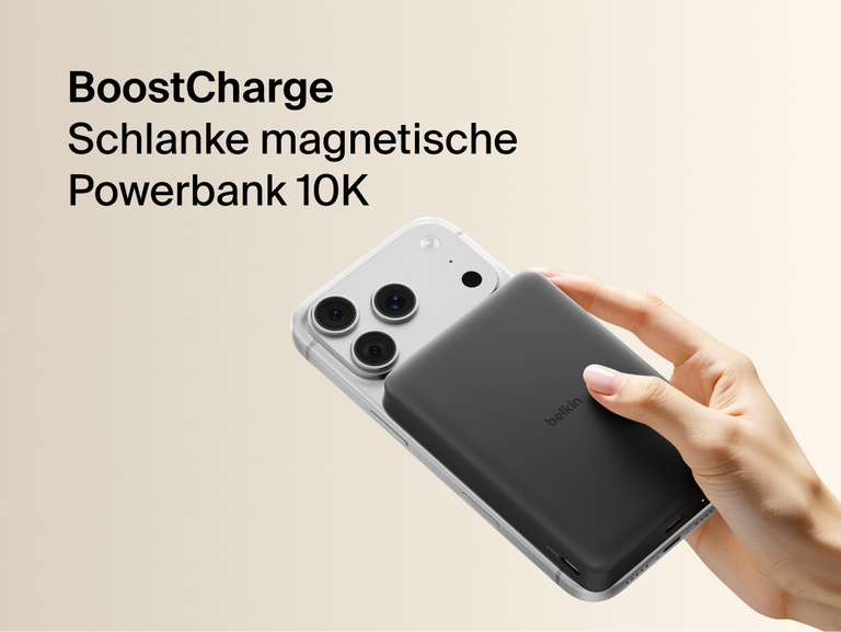 Belkin BoostCharge Slim Magnetic Power Bank 10K magnetically attached to iPhone, demonstrating secure wireless charging with a slim portable design