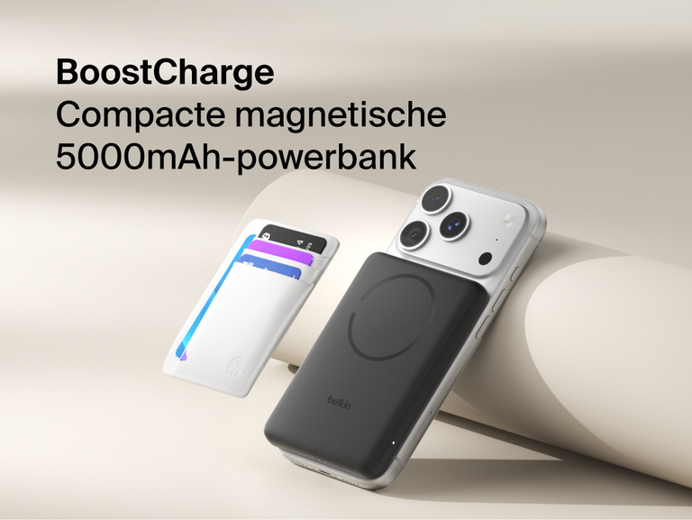 Belkin BoostCharge Slim Magnetic Power Bank 5K with Qi2 wirelessly attached to a smartphone, featuring a slim magnetic design with integrated card storage for portable on-the-go charging.