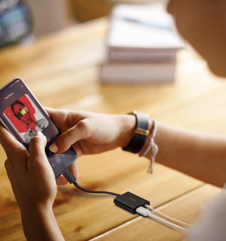 An image of Belkin 3.5mm Audio & USB-C Charger Adapter in use.
