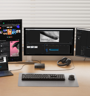 Belkin Universal 16-Port Triple Display USB-C Dock connected to a laptop and three monitors, supporting a professional multi-display workstation for content creation and productivity.