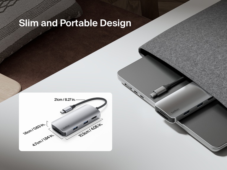 A Belkin Connect USB-C 5-in-1 Multiport Hub is shown partially tucked into a laptop sleeve, emphasizing its slim and portable design, with an inset image displaying its compact dimensions.