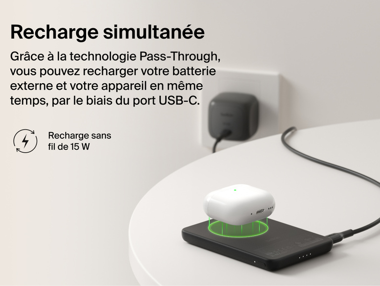 Belkin BoostCharge Slim Magnetic Power Bank 5K with Qi2 demonstrating pass-through charging, wirelessly powering a device while the power bank recharges via USB-C.