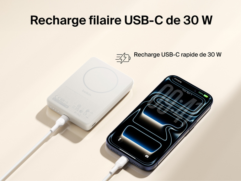 Slim Magnetic Power Bank 10K with Qi2 connected by USB-C cable delivering fast wired charging to smartphone