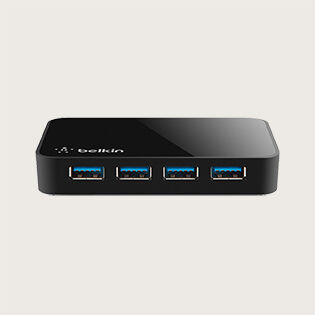 A black Belkin USB hub with four USB 3.0 ports in a row, providing multiple connections for devices. The hub has a sleek, compact design, suitable for expanding USB connectivity on a desktop or laptop.