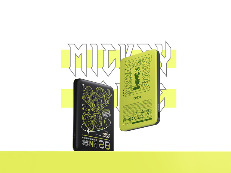 Belkin BoostCharge Slim Magnetic Power Bank 5K shown magnetically attached to a smartphone beside a slim wallet accessory, highlighting its compact portable charging design.