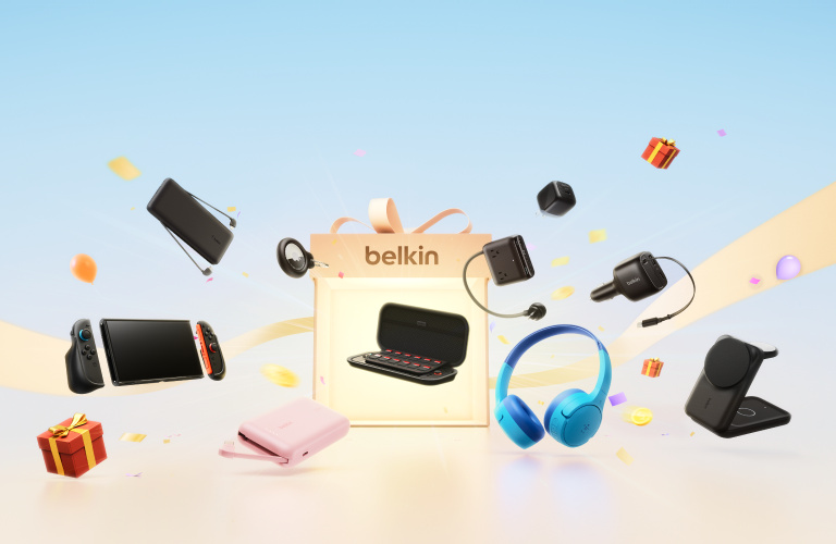 Belkin promotional banner featuring a gift box surrounded by gaming, charging, audio and mobile accessories with festive gifts and confetti.