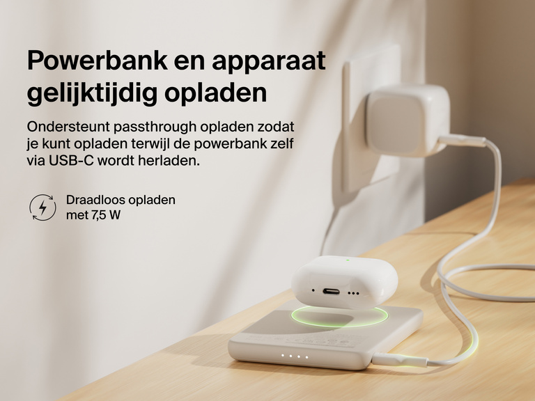 Belkin BoostCharge Slim Magnetic Power Bank 5K shown wirelessly charging earbuds while recharging via USB-C, demonstrating 7.5W pass-through charging functionality.