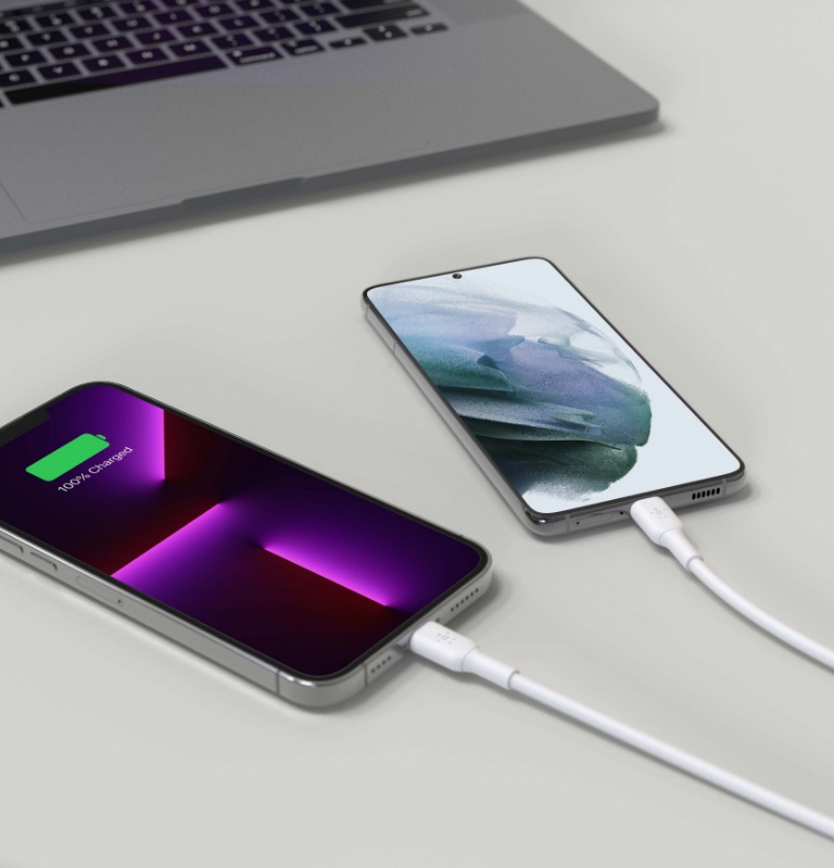 An image of two devices charging simultaneously, one has reached full charge.
