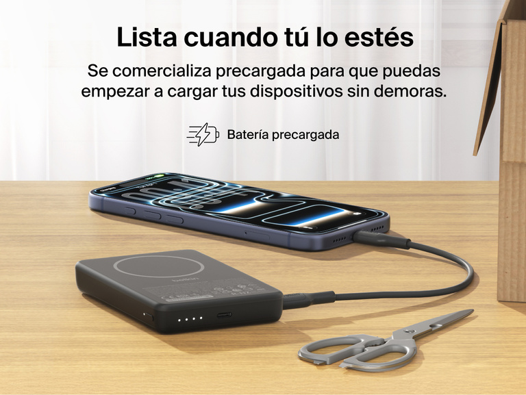Belkin BoostCharge Slim Magnetic Power Bank 10K charging iPhone via USB-C on desk showing precharged battery ready for immediate use