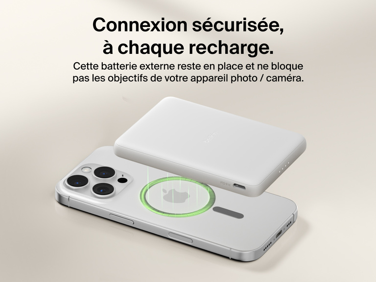Belkin BoostCharge Slim Magnetic Power Bank 5K shown magnetically aligned between a smartphone and wallet accessory, demonstrating precise magnetic ring for secure attachment and camera-safe design.