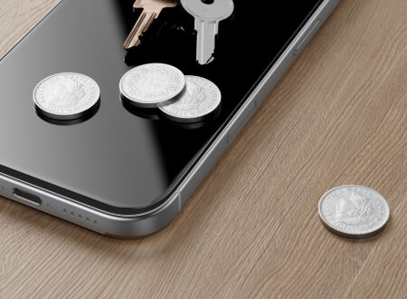 Close-up of a smartphone screen with coins and keys resting on it, illustrating scratch resistance of the screen protector. Close-up of a smartphone screen with coins and keys resting on it, illustrating scratch resistance of the screen protector.