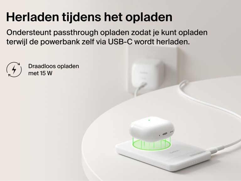 Belkin BoostCharge Slim Magnetic Power Bank 5K with Qi2 demonstrating pass-through charging, wirelessly powering a device while the power bank recharges via USB-C.