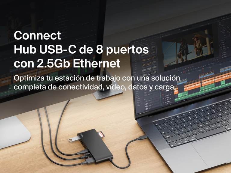 Se muestra el hub USB-C de 8 puertos con 2.5Gb Ethernet de Belkin proporcionando conectividad entre un portátil y un monitor, transferencias de datos de alta velocidad, extensión de pantalla y carga de dispositivos para optimizar el equipamiento y la funcionalidad de cualquier estación de trabajo.