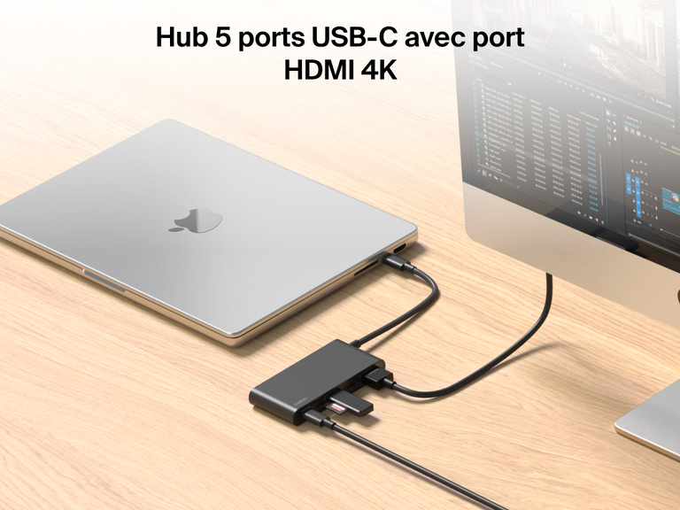Belkin Connect 5-Port USB-C Hub with 4K HDMI links a MacBook to an external monitor and multiple devices on a wooden desk.