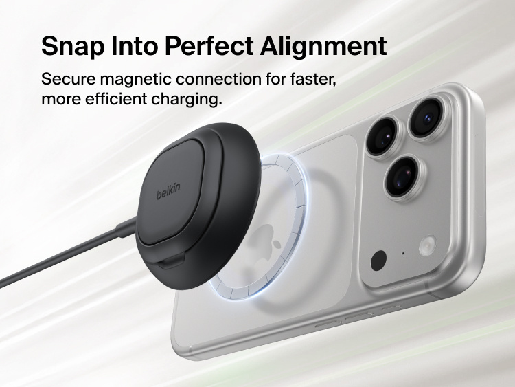 Belkin UltraCharge Magnetic Charger with Qi2 25W shown snapping securely onto the back of a smartphone for perfectly aligned, efficient magnetic wireless charging.