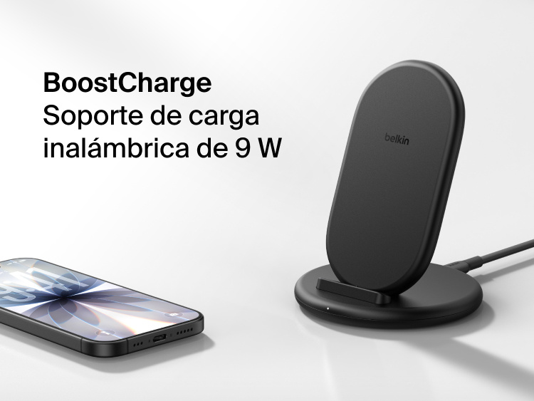 Belkin BoostCharge Wireless Charging Stand 15W shown with smartphone nearby, featuring a sleek upright design for fast wireless charging.