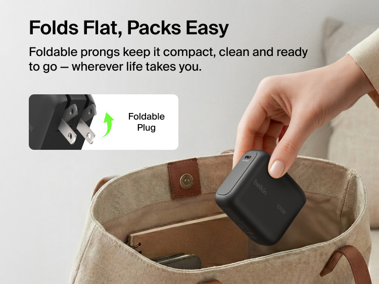 BoostCharge USB-C GaN Wall Charger 100W with foldable prongs being placed into a travel bag to highlight compact portable design for everyday charging on the go