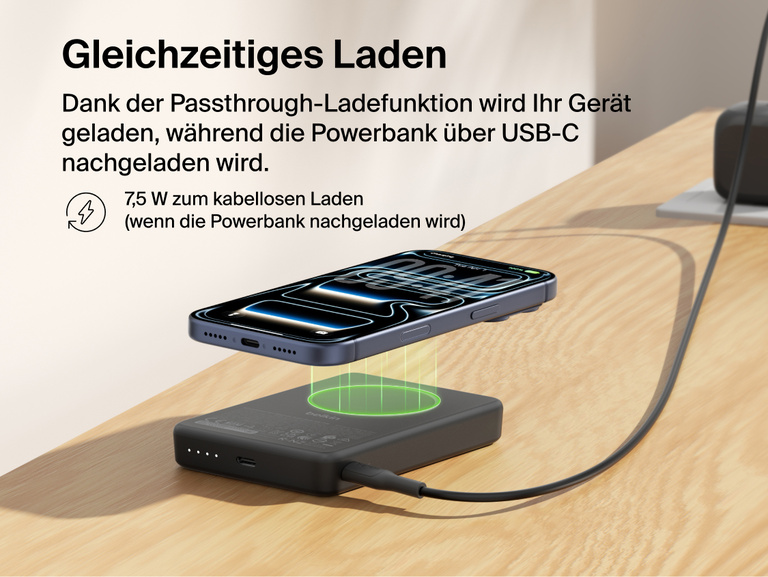 Belkin BoostCharge Slim Magnetic Power Bank 10K delivering pass-through charging with a smartphone wirelessly charging on top while the power bank recharges via USB-C cable