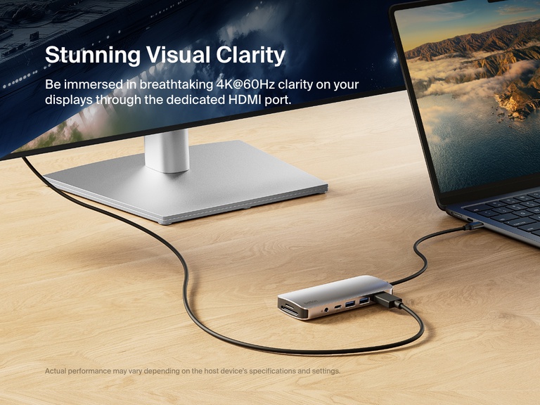 影像顯示 Belkin Connect USB-C 7 合 1 多埠集線器連接到手提電腦和外部螢幕，強調可透過專屬 HDMI 連接埠提供 4K@60Hz 清晰畫面。