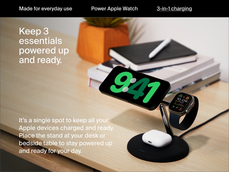 Image of a black Belkin BoostCharge Pro 3-in-1 Magnetic Wireless Charging Stand with Qi2 15W on a desk, simultaneously charging an iPhone, Apple Watch, and AirPods to keep essential devices powered and ready.