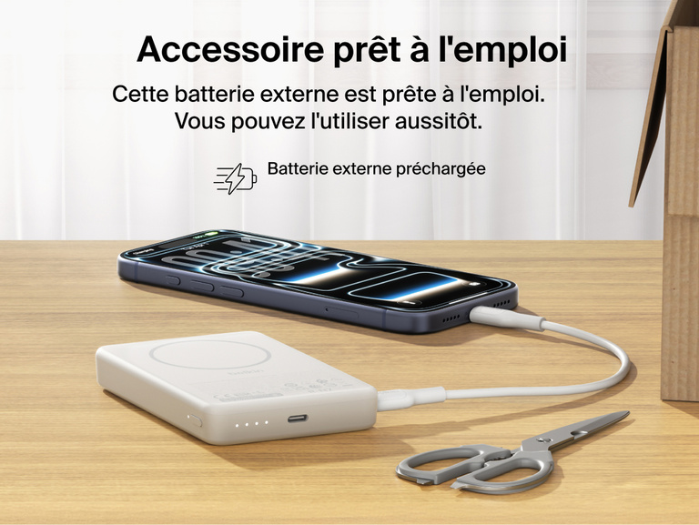 Slim Magnetic Power Bank 10K with Qi2 charging smartphone on desk with LED battery indicators and precharged readiness