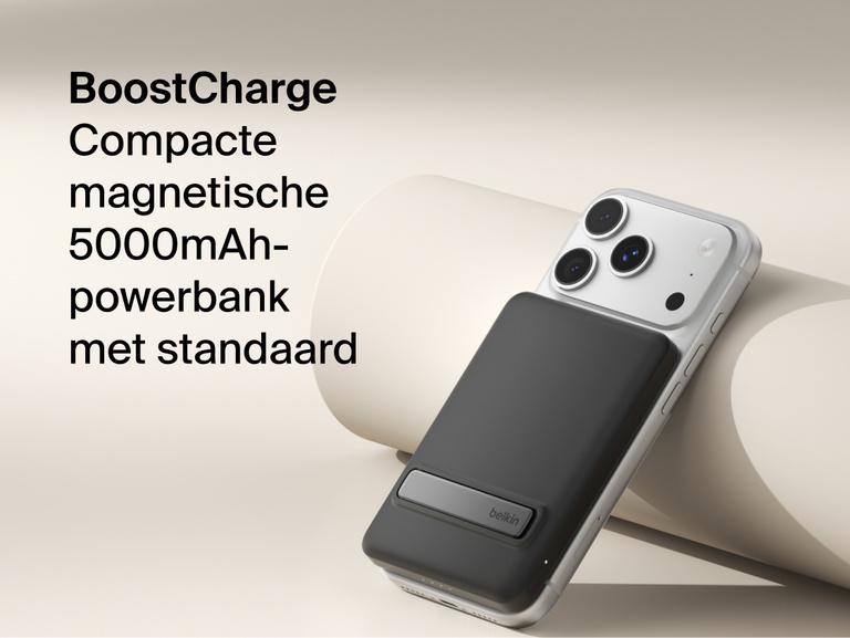 Belkin BoostCharge Slim Magnetic Power Bank 5K with Qi2 wirelessly attached to a smartphone, featuring a slim magnetic design with integrated card storage for portable on-the-go charging.