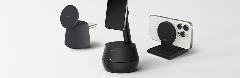 Belkin products displayed on a white surface: Stage Auto-Tracking Stand Pro with DockKit, BoostCharge Pro 2-in-1 Wireless Charging Dock with MagSafe 15W, and Stage iPhone Mount with MagSafe for Apple TV 4K.