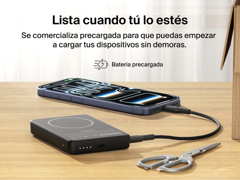 Slim Magnetic Power Bank 10K with Qi2 charging smartphone on desk with precharged battery indicator lights visible