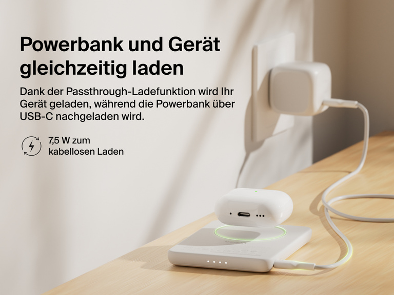 Belkin BoostCharge Slim Magnetic Power Bank 5K shown wirelessly charging earbuds while recharging via USB-C, demonstrating 7.5W pass-through charging functionality.