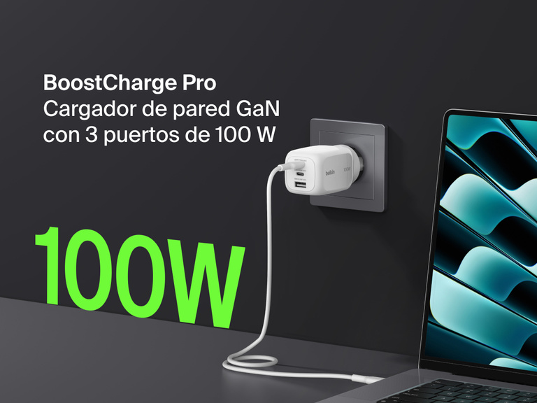 BoostCharge Pro 3-Port GaN Wall Charger 100W plugged into a wall outlet, fast charging a laptop with bold green “100W” text highlighting its powerful output.