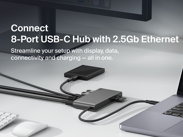 Belkin Connect 8-Port USB-C Hub with 2.5Gb Ethernet connecting a laptop and desktop monitor, supporting high-speed data transfer, display extension, and device charging for streamlined workspace setup.