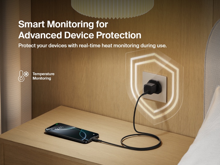 Belkin BoostCharge USB-C Wall Charger 25W plugged into a bedside outlet, showcasing real-time temperature monitoring for advanced device protection and safe charging.