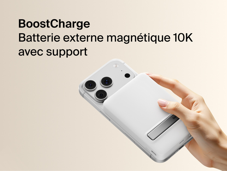 Slim Magnetic Power Bank 10K with Qi2 magnetically attached to smartphone showing integrated kickstand and handheld use