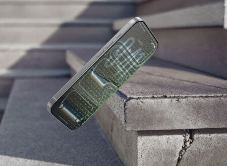 Smartphone with a green hexagonal protective screen overlay falling near concrete steps, emphasizing screen protection durability. Smartphone with a green hexagonal protective screen overlay falling near concrete steps, emphasizing screen protection durability.