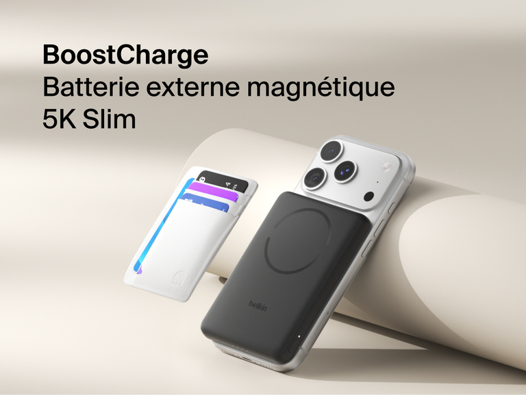 Belkin BoostCharge Slim Magnetic Power Bank 5K with Qi2 wirelessly attached to a smartphone, featuring a slim magnetic design with integrated card storage for portable on-the-go charging.